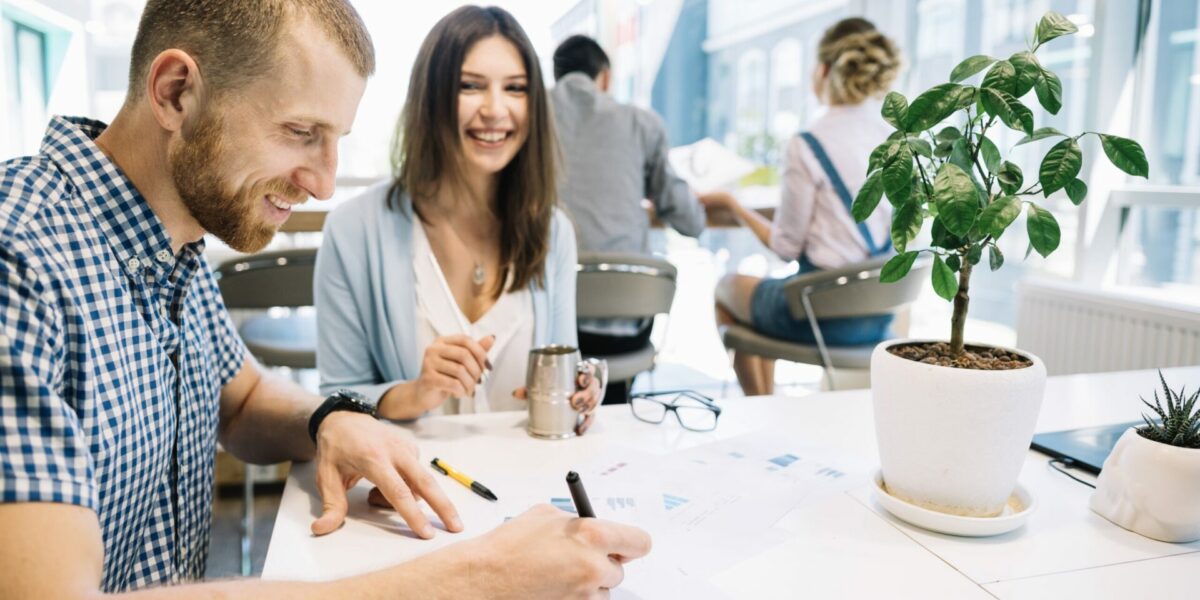 cheerful-coworkers-with-papers